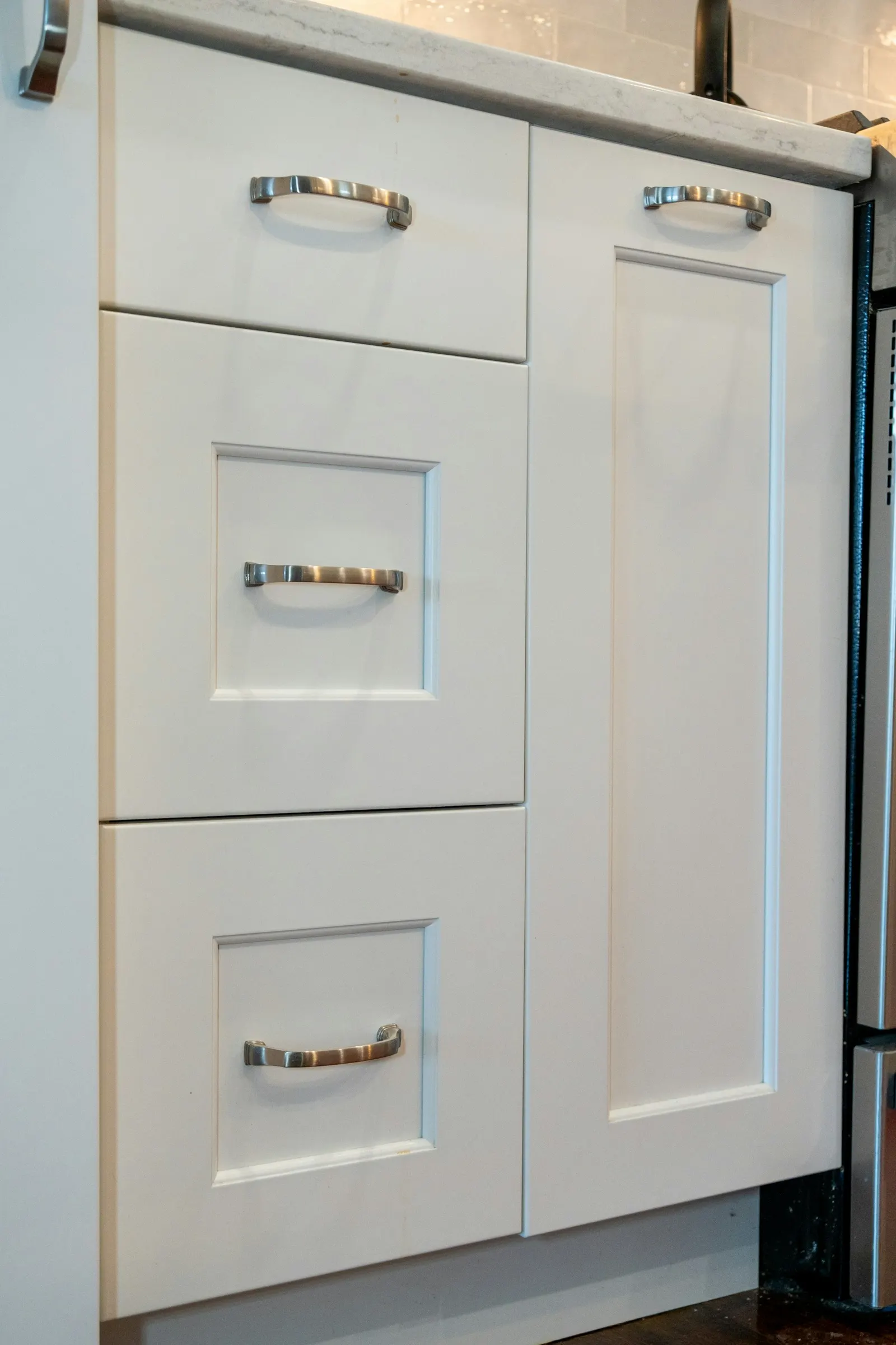 Kitchen with rich professionally painted cabinetry and modern finishes